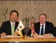 Chris Dagger and Sang-Ho Cho sign the agreement in Seoul